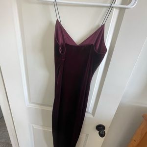 Small mid length tight velvet strappy dress.